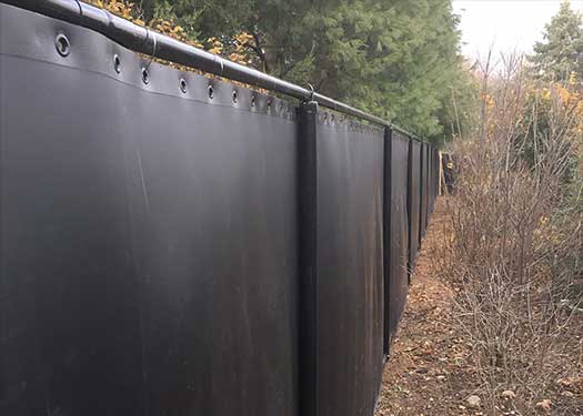 AcoustiFence On Berm Reduces Noise